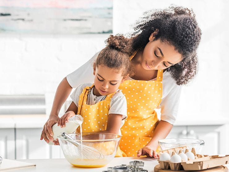 mom and daughter doing fun fall activity at home