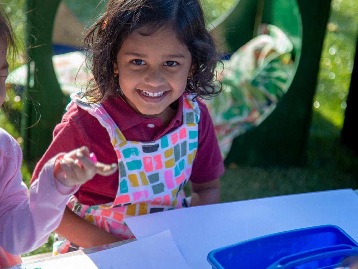 Child smiling outdoors