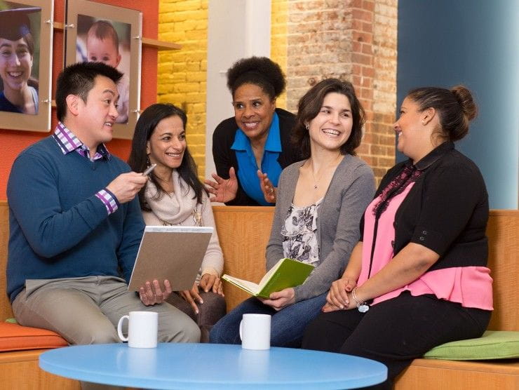 employees sitting and talking 