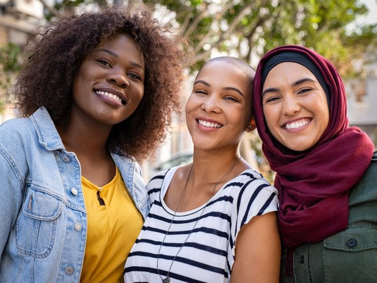 three women smiling