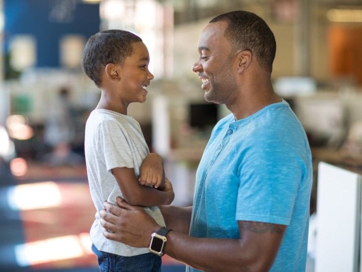 dad hugging child 