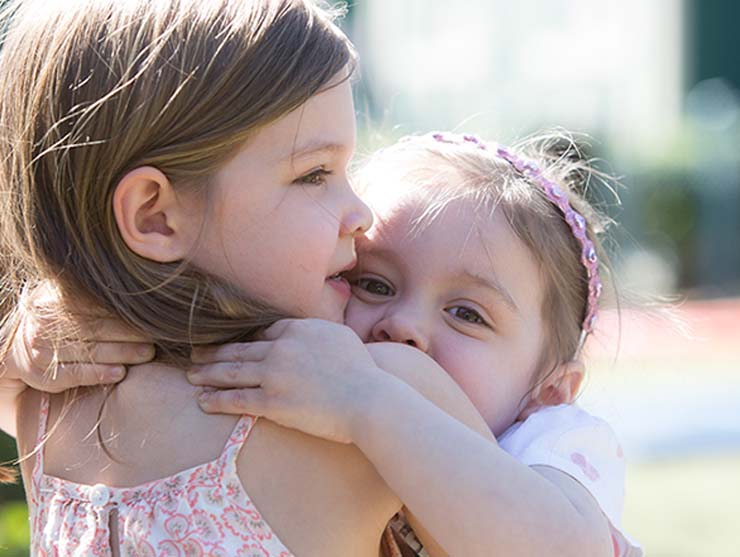 Sisters Hugging||