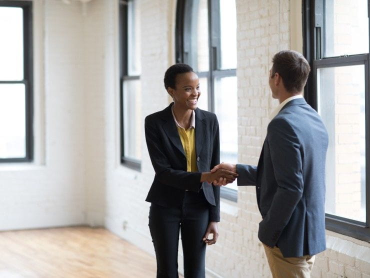 co-workers shaking hands 